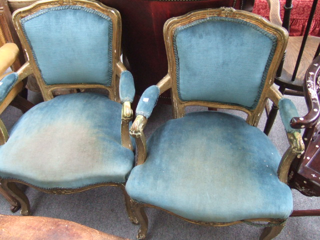 Appraisal: A pair of Louis XV style giltwood fauteuils with cartouche