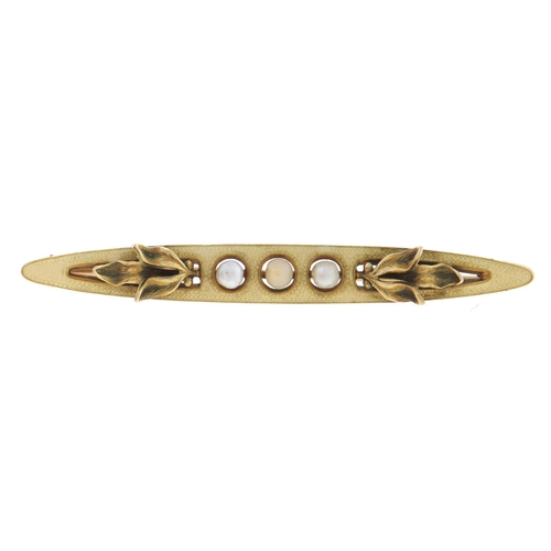 Appraisal: A cultured pearl and gold and primrose enamel shuttle shaped