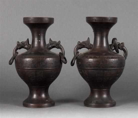 Appraisal: Pair of Chinese archaic style bronze vases dragon head handles