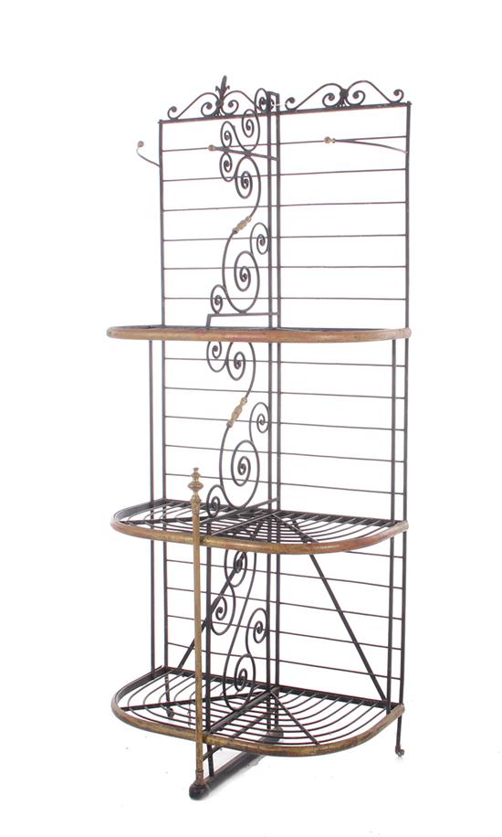 Appraisal: Wrought-iron and brass baker's rack th century scrolling back and