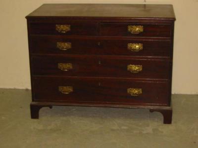 Appraisal: A MAHOGANY CHEST with moulded edged top two short over