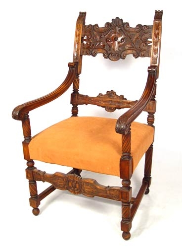 Appraisal: PROFUSELY CARVED THRONE CHAIR Refinished mahogany open arm chair ''