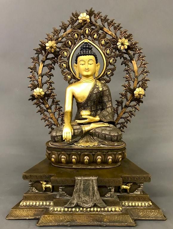 Appraisal: Tibetan Gilt Silvered Bronze Seated Buddha Tibetan gilt and silvered