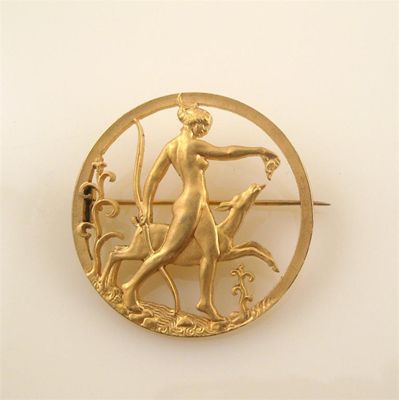 Appraisal: The pierced gilt metal brooch depicts the goddess Diana hunting