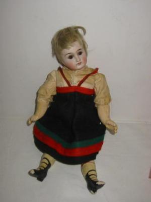 Appraisal: A Belton type bisque head doll with fixed brown glass