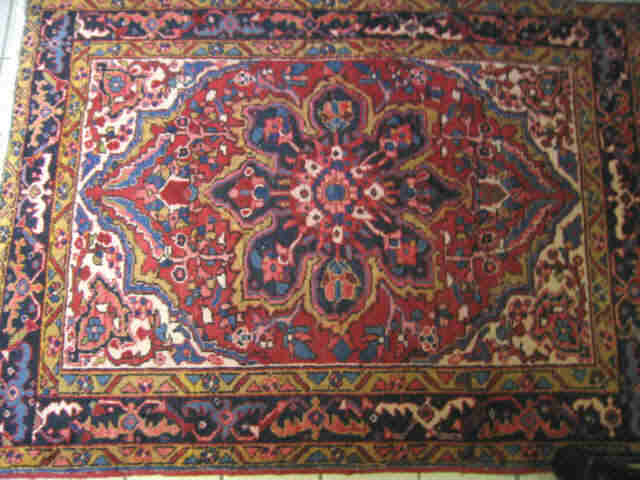 Appraisal: Heriz Persian Handmade Rug central medallion on red field elaborate