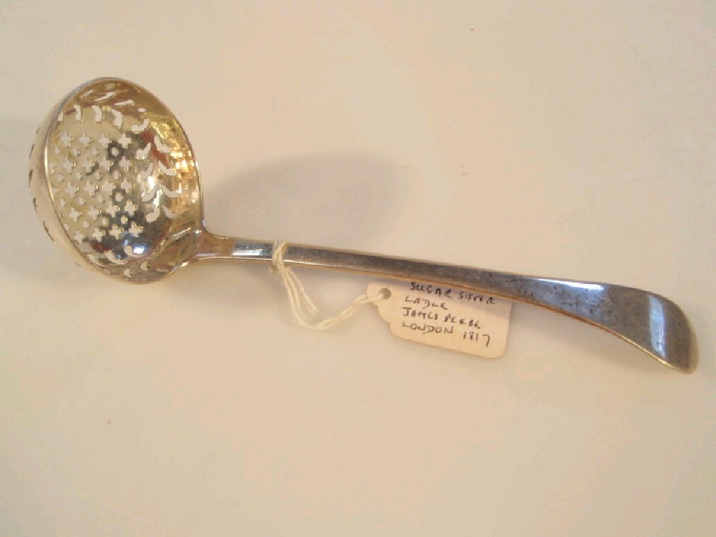 Appraisal: A George III silver sifter spoon Maker J B London