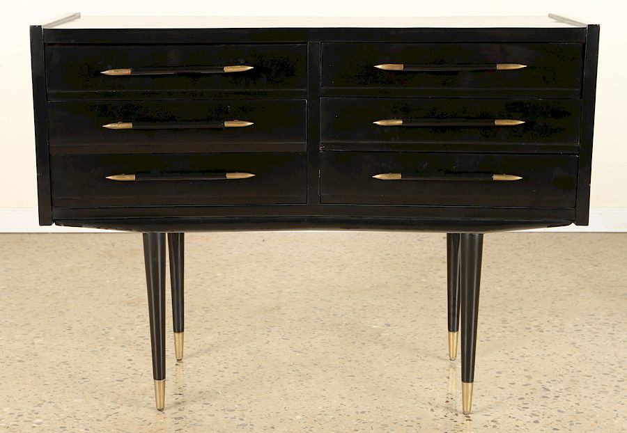 Appraisal: EBONIZED COMMODE MANNER OF ROBSJOHN GIBBINGS A six drawer ebonized