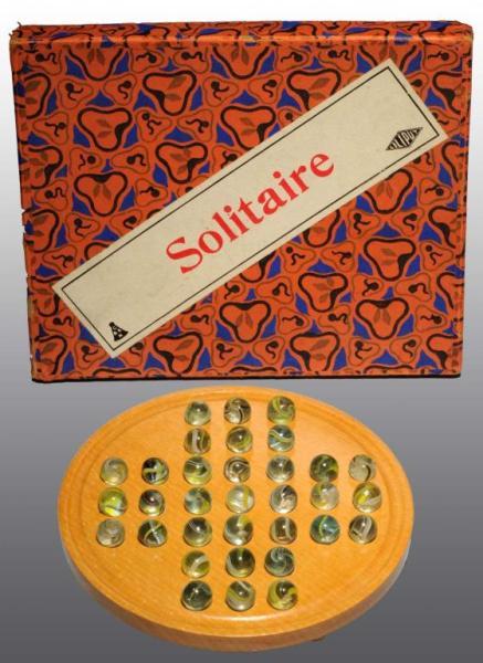 Appraisal: Solitaire Board Set Description Set contains open-core swirl marbles that