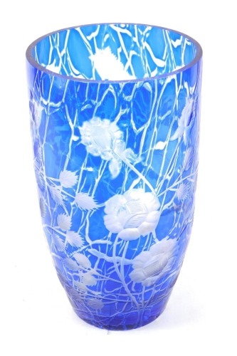 Appraisal: A blue etched glass vase on a blue and white