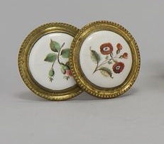 Appraisal: TWO BATTERSEA ENAMEL AND BRASS TIEBACKS Circa With similar floral