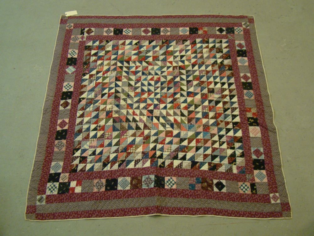 Appraisal: PIECED QUILT Late th Early th CenturyIn central multicolor triangular