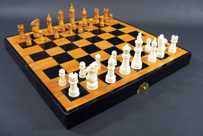 Appraisal: IVORY CHESS SET hand carved with natural off white and