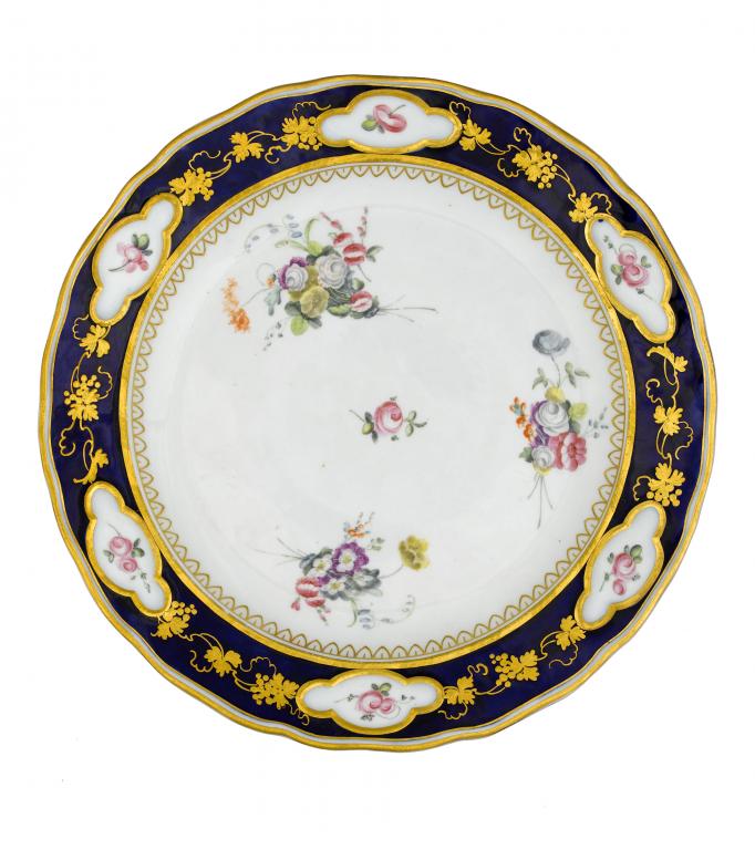 Appraisal: A CHELSEA-DERBY PLATE painted by Edward Withers with a central