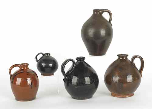 Appraisal: Five American redware ovoid jugs th c tallest - h