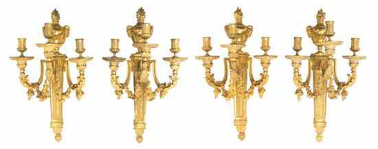 Appraisal: A Set of Four Louis XVI Gilt Bronze Three-Light Sconces