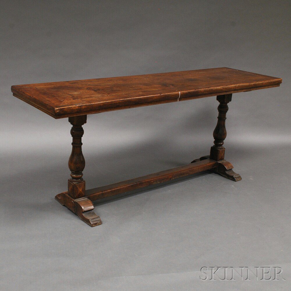 Appraisal: English Walnut Trestle Table th century the rectangular top set