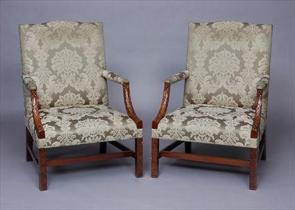 Appraisal: PAIR OF GEORGE III-STYLE LIBRARY ARMCHAIRS Each flat cresting rail