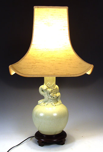 Appraisal: CHINESE CELADON LAMP Figural dragon motif porcelain base on wood