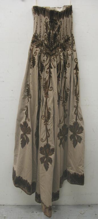 Appraisal: A th century full length cream wool strapless dress fitted