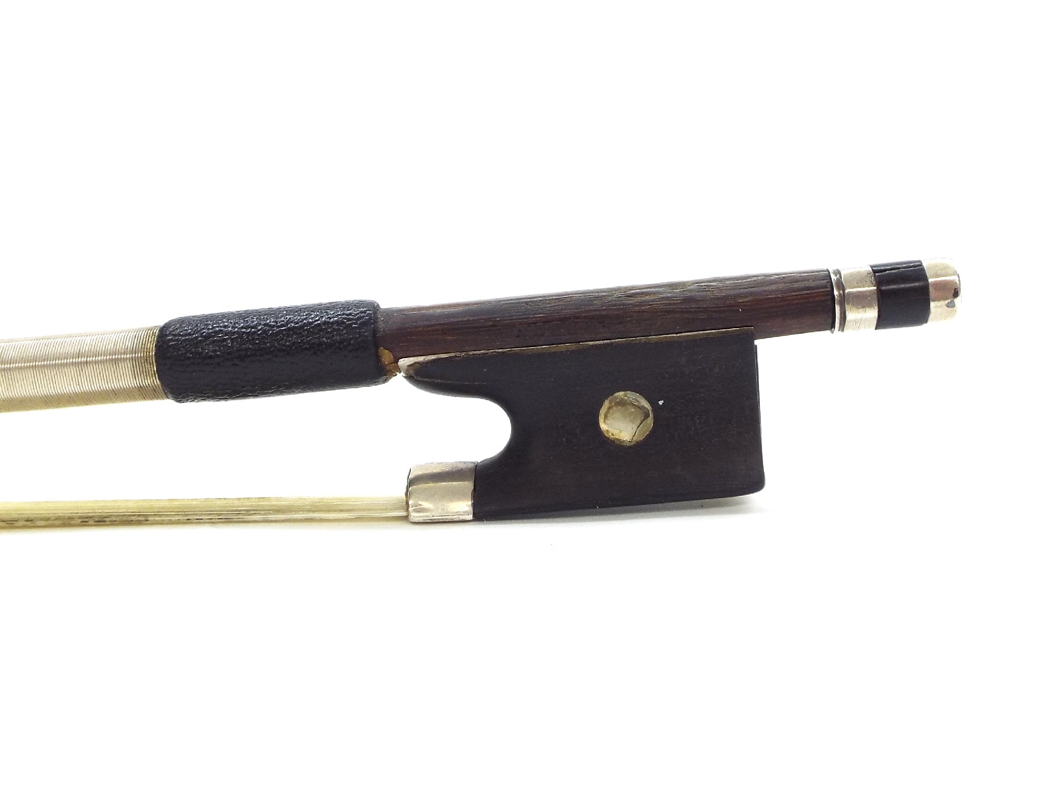 Appraisal: Silver mounted violin bow indistinctly branded the stick octagonal the