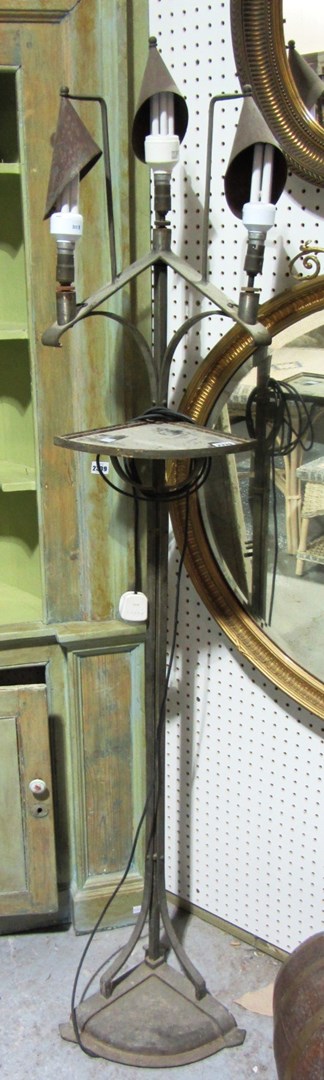 Appraisal: An unusual steel standard lamp with mirrored shelf