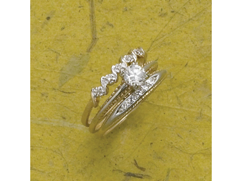 Appraisal: DIAMOND THREE RING DIAMOND BRIDAL SET Two tone gold bridal