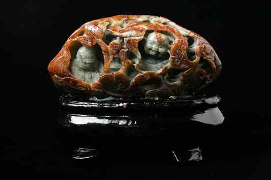 Appraisal: CHINESE RUSSET AND CELADON JADE BOULDER Carved to depict two