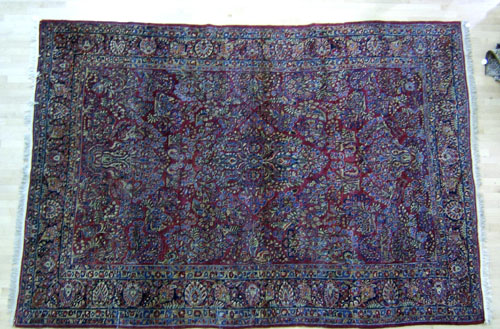 Appraisal: Roomsize Sarouk rug ca with overall floral pattern on a