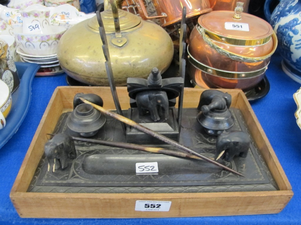 Appraisal: Carved ebony desk stand with four elephant figures