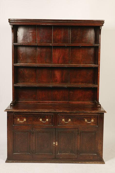 Appraisal: A GEORGE III OAK DRESSER the raised back with three