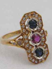 Appraisal: A yellow metal tests carat gold ruby sapphire and diamond