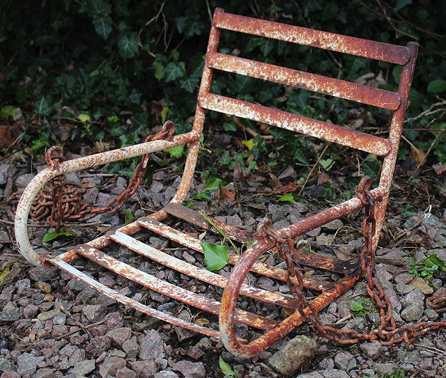 Appraisal: A WHITE PAINTED WROUGHT IRON CHILD'S SWING SEAT with suspension