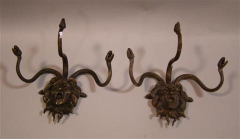 Appraisal: MEDUSA HEAD PATINATED BRONZE WALL PLAQUES Pair of bronze Medusa