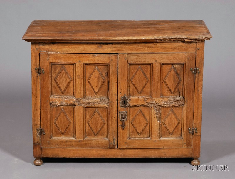 Appraisal: Spanish Provincial Carved Walnut Two-Door Low Cabinet rectangular top and