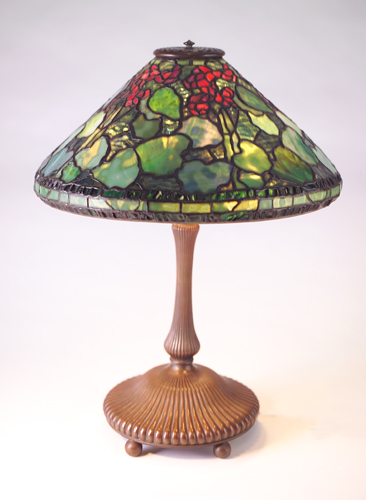 Appraisal: TIFFANY STUDIOS Lamp with fluted bronze base topped by three