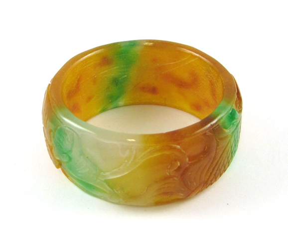 Appraisal: HEAVY MULTI-COLOR CARVED JADE BANGLE weighing grams and measuring -