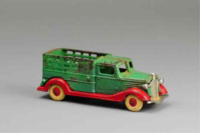 Appraisal: CHAMPION STAKE TRUCK Cast iron green and red color combo