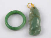 Appraisal: A Chinese carved jade pendant with yellow metal fitting marked