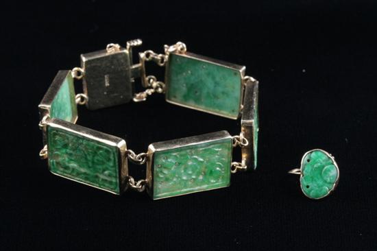 Appraisal: K YELLOW GOLD AND CHINESE CARVED GREEN JADE FLEXIBLE PANEL-LINK