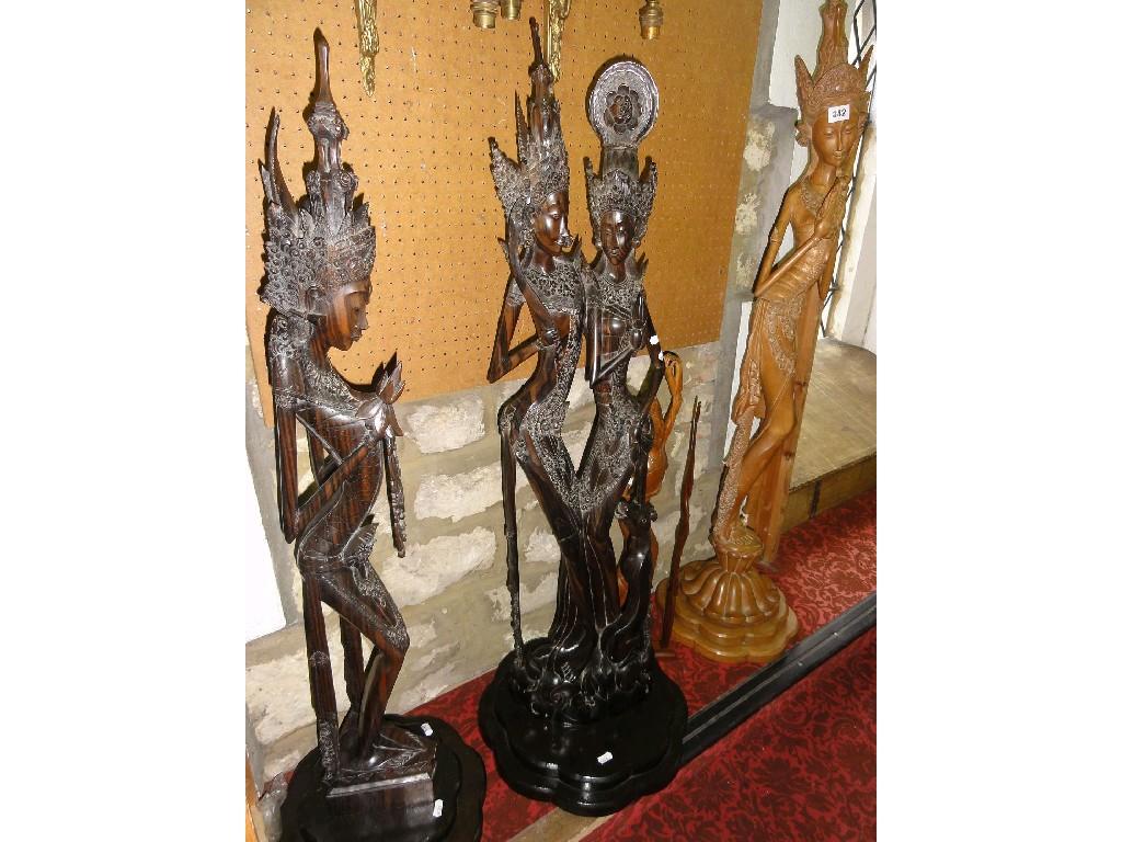 Appraisal: A collection of four hardwood carvings of dancers from Thailand