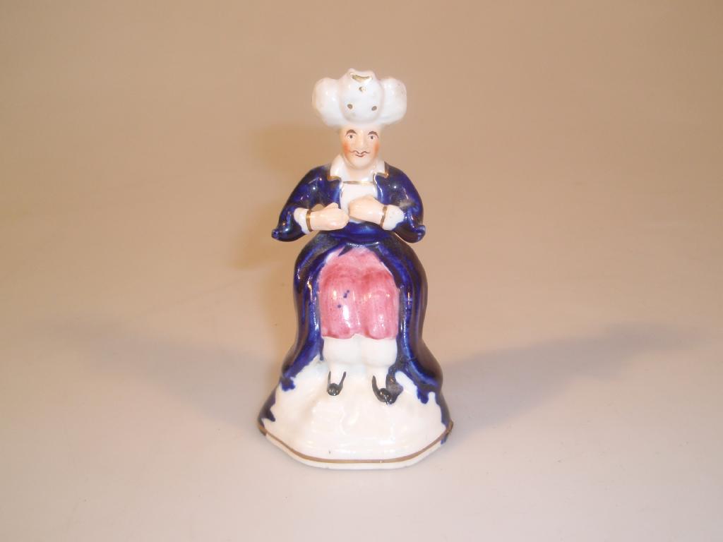 Appraisal: A thC Staffordshire porcelain figure of a seated Turk partially