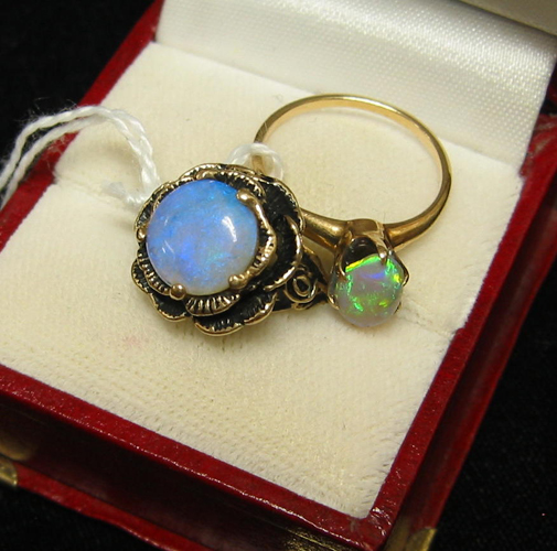 Appraisal: TWO OPAL AND FOURTEEN KARAT GOLD SOLITAIRE RINGS One with