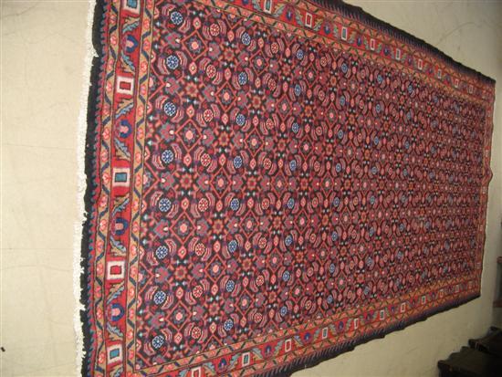 Appraisal: Hamadan dark ground rug woven with flowers and symbols one