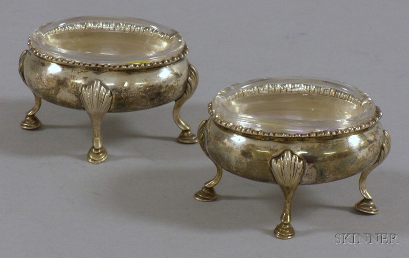 Appraisal: Pair of Footed Georgian Silver Salts with Glass Inserts cabriole