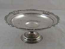 Appraisal: A silver cake dish on stand with pierced border and