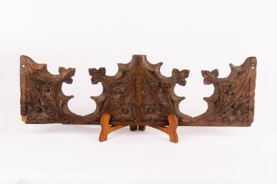 Appraisal: An early carved lime wood fragment pierced trefoils with poppies