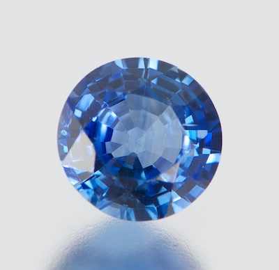 Appraisal: An Unmounted Blue Sapphire Carat Round faceted cut medium light