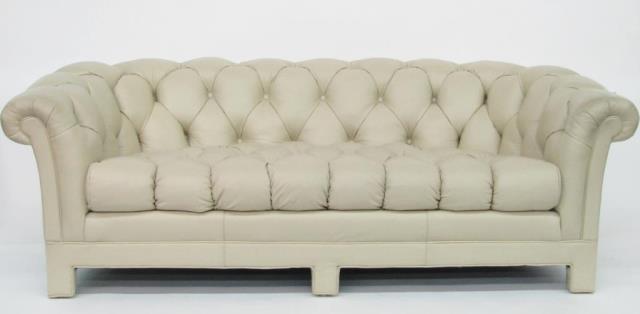 Appraisal: A Chesterfield style leather sofa with button tufted cream leather