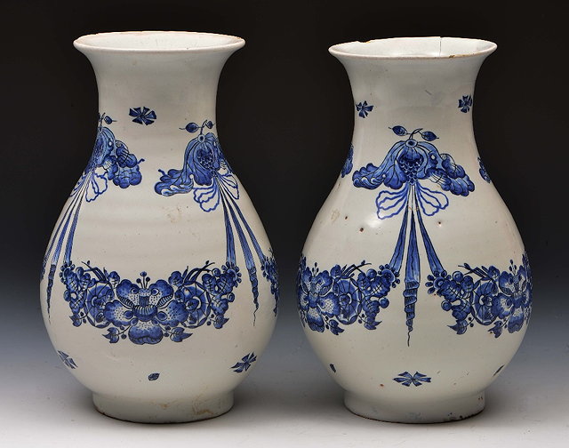 Appraisal: Pair of English Delft vaseswith blue swags of flower designs